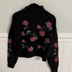 Black Turtle Neck with Rose Detail